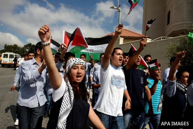 Palestinians march during a rally to support the Palestinian statehood bid in the United Nations, in the West Bank city of Ramallah, on Sept. 20, 2011. The Palestinians brushed aside heated Israeli objections and a promi...