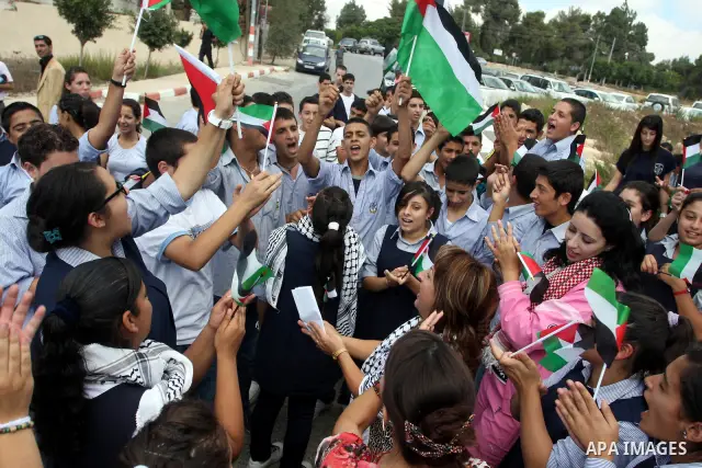 Palestinians march during a rally to support the Palestinian statehood bid in the United Nations, in the West Bank city of Ramallah, on Sept. 20, 2011. The Palestinians brushed aside heated Israeli objections and a promi...