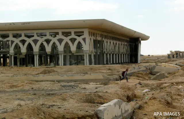 A Palestinian walks the rubble of the Gaza International Airport in Rafah in the southern Gaza Strip, on September 20, 2011. The 70-million-dollar airport which opened in November 1998 has been closed since February 2001...