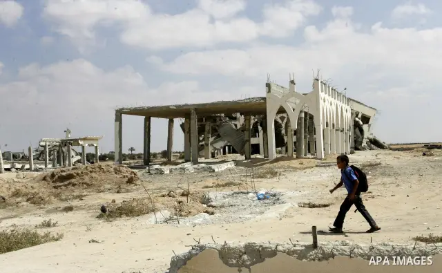 A Palestinian walks the rubble of the Gaza International Airport in Rafah in the southern Gaza Strip, on September 20, 2011. The 70-million-dollar airport which opened in November 1998 has been closed since February 2001...