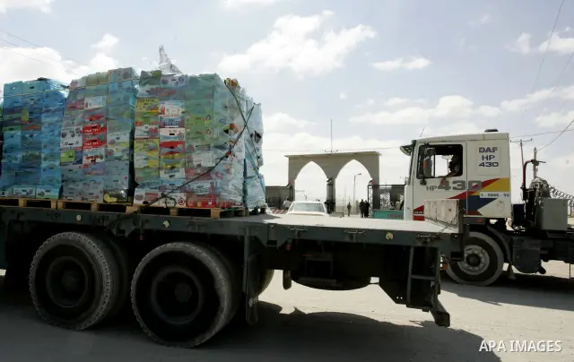 Trucks carrying goods and food supplies arrive in Rafah town in the southern Gaza Strip on September 20, 2011, after they crossed the Kerem Shalom terminal from Israel. The Palestinians are preparing to submit a formal r...