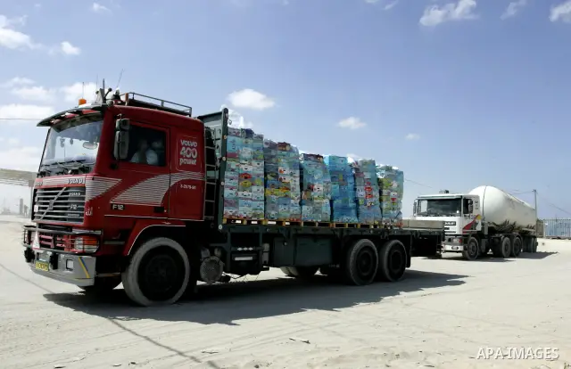 Trucks carrying goods and food supplies arrive in Rafah town in the southern Gaza Strip on September 20, 2011, after they crossed the Kerem Shalom terminal from Israel. The Palestinians are preparing to submit a formal r...