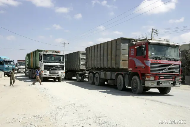 Trucks carrying goods and food supplies arrive in Rafah town in the southern Gaza Strip on September 20, 2011, after they crossed the Kerem Shalom terminal from Israel. The Palestinians are preparing to submit a formal r...