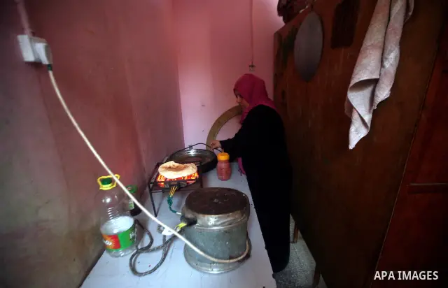 A Palestinian woman works at her house in the Jabaliya refugee camp in the northern area of the Gaza Strip on 20 September 2011. A diplomatic showdown looms at the United Nations this month when Palestinian President Mah...