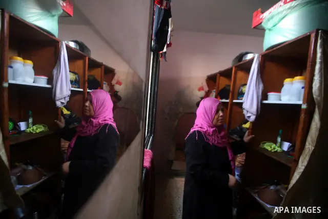 A Palestinian woman works at her house in the Jabaliya refugee camp in the northern area of the Gaza Strip on 20 September 2011. A diplomatic showdown looms at the United Nations this month when Palestinian President Mah...