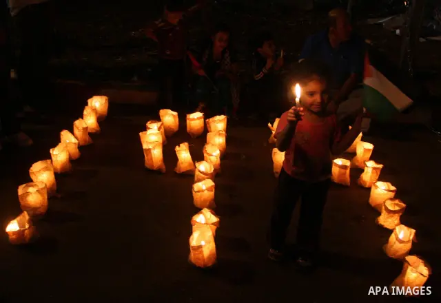 Palestinians light candles representing the number '194' during a rally in the West Bank city of Ramallah, in support of President Mahmoud Abbas' bid for statehood recognition in the United Nations, September 20, 2011. A...