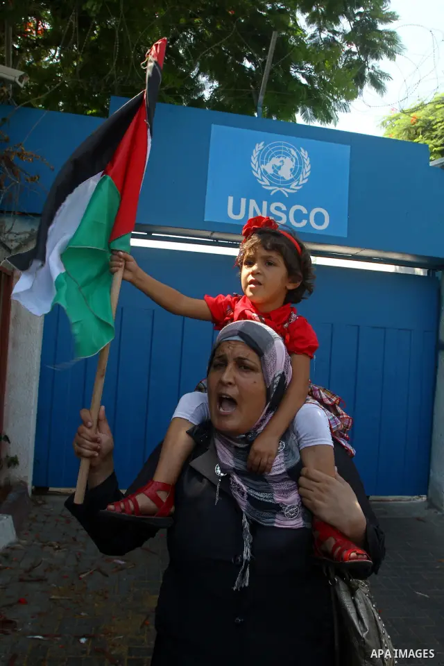 A Palestinian woman chants slogans during a demonstration in support of Palestinian leader Mahmud Abbas' bid for statehood recognition at the United Nations on September 21, 2011 in Gaza City. Palestinians are preparing...