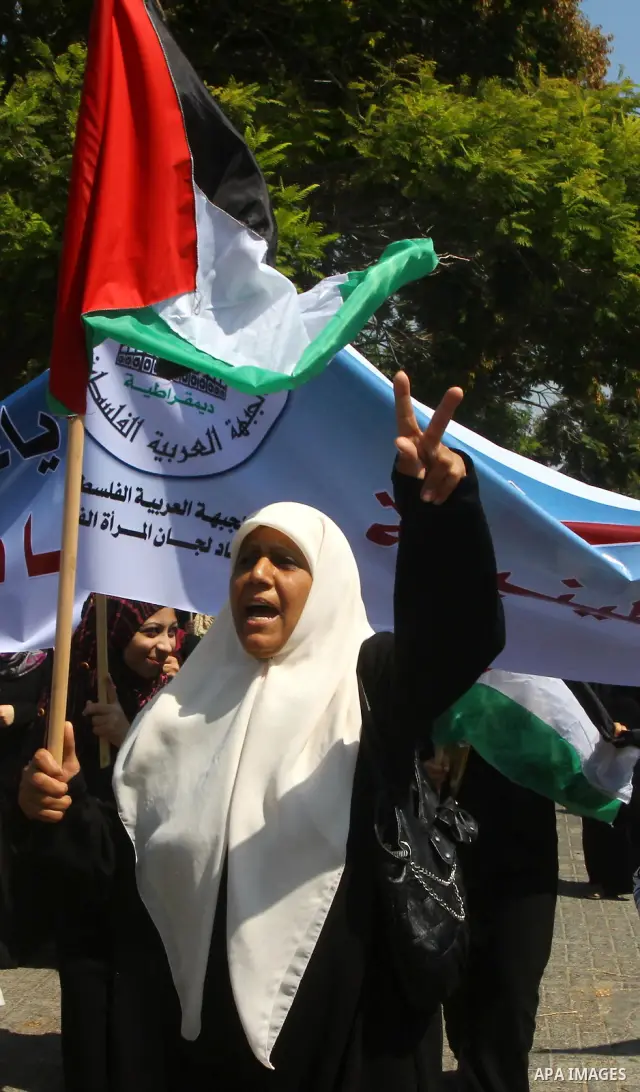 A Palestinian woman chants slogans during a demonstration in support of Palestinian leader Mahmud Abbas' bid for statehood recognition at the United Nations on September 21, 2011 in Gaza City. Palestinians are preparing...
