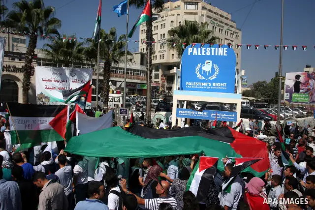 Palestinians participate in a rally in support of the Palestinian bid for statehood recognition in the United Nations, in the West Bank city of Ramallah, Wednesday, Sept. 21, 2011. Thousands of flag-waving Palestinians r...