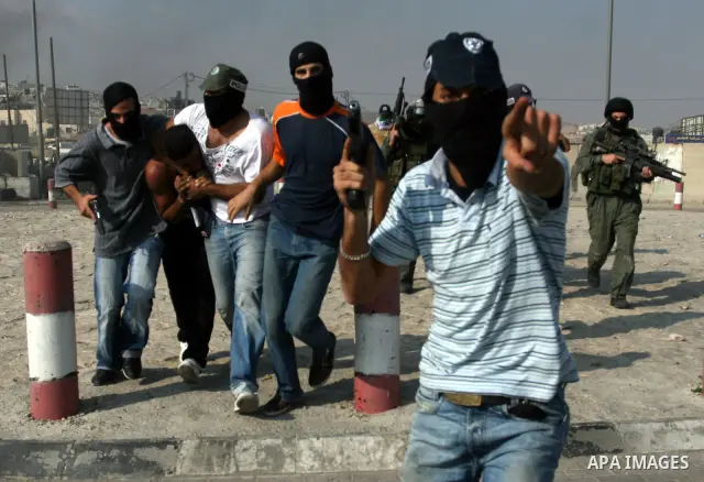 Undercover Israeli police and border police officers arrest Palestinian demonstrators during clashes with the Israeli military at the Qalandia checkpoint between the West Bank city of Ramallah and Jerusalem, Wednesday, S...