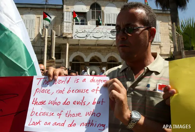 Palestinians hold up signs against US President Barack Obama during a protest in the northern West Bank city of Nablus on September 22, 2011. Palestinians slammed US President Barack Obama's United Nations address a day...