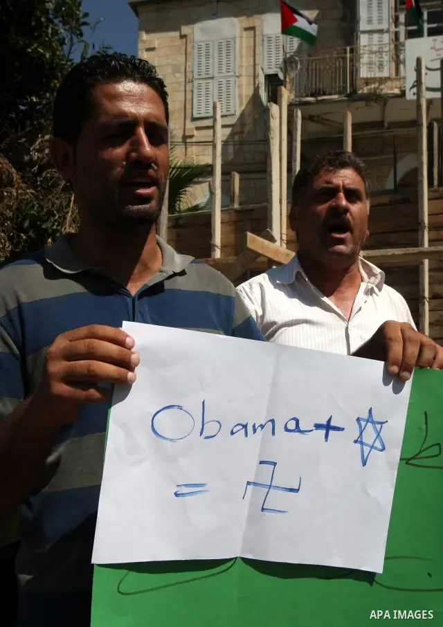 Palestinians hold up signs against US President Barack Obama during a protest in the northern West Bank city of Nablus on September 22, 2011. Palestinians slammed US President Barack Obama's United Nations address a day...