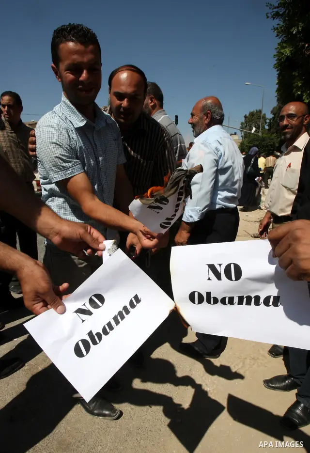 Palestinians hold up signs against US President Barack Obama during a protest in the northern West Bank city of Nablus on September 22, 2011. Palestinians slammed US President Barack Obama's United Nations address a day...