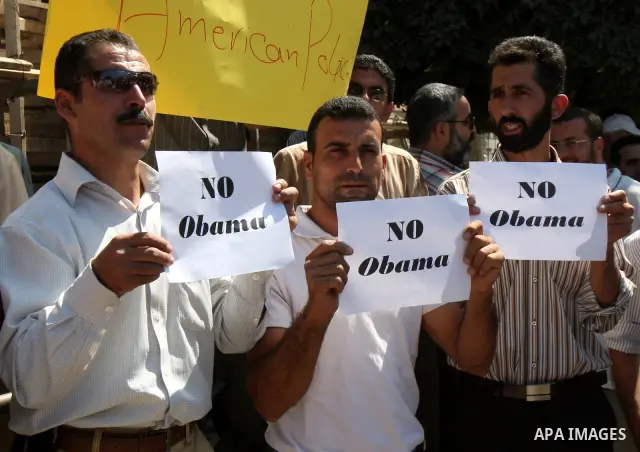 Palestinians hold up signs against US President Barack Obama during a protest in the northern West Bank city of Nablus on September 22, 2011. Palestinians slammed US President Barack Obama's United Nations address a day...