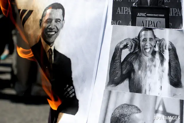 Palestinians burn manipulated pictures of US President Barack Obama during an anti U.S. demonstration in the West Bank city of Ramallah, Thursday, Sept. 22, 2011. Palestinian protesters have denounced President Barack Ob...