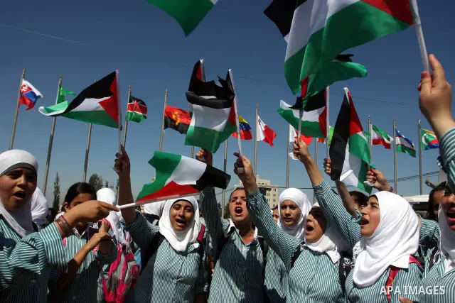 Palestinians school children participate a demonstration in support of the Palestinian bid for statehood recognition in the United Nations in the West Bank city of Ramallah, Thursday, Sept. 22, 2011. Palestinian proteste...