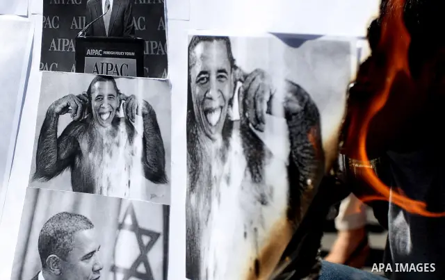 Palestinians burn manipulated pictures of US President Barack Obama during an anti U.S. demonstration in the West Bank city of Ramallah, Thursday, Sept. 22, 2011. Palestinian protesters have denounced President Barack Ob...