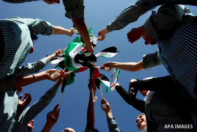 Palestinians school children participate a demonstration in support of the Palestinian bid for statehood recognition in the United Nations in the West Bank city of Ramallah, Thursday, Sept. 22, 2011. Palestinian proteste...