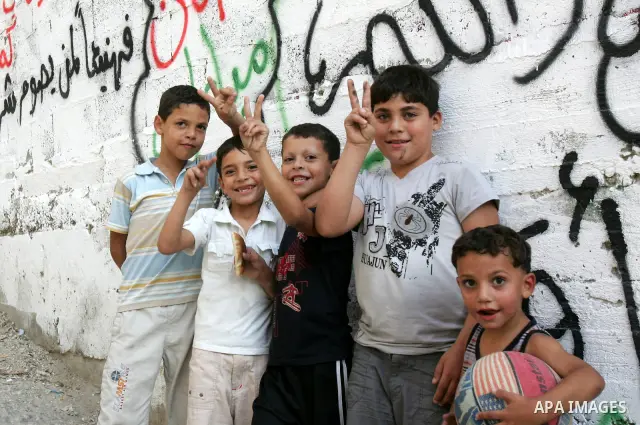 Palestinian children play at a street on September 22, 2011 in the east Jerusalem neighborhood of Silwan. Palestinians are preparing to submit a formal request to become the 194th member of the United Nations when the Ge...