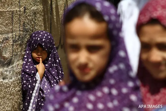 Palestinian girls stand in an alley at the al-Shati refugee camp in Gaza City on September 23, 2011. Photo by Ashraf Amra