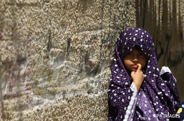 Palestinian girls stand in an alley at the al-Shati refugee camp in Gaza City on September 23, 2011. Photo by Ashraf Amra