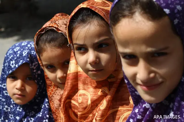 Palestinian girls stand in an alley at the al-Shati refugee camp in Gaza City on September 23, 2011. Photo by Ashraf Amra