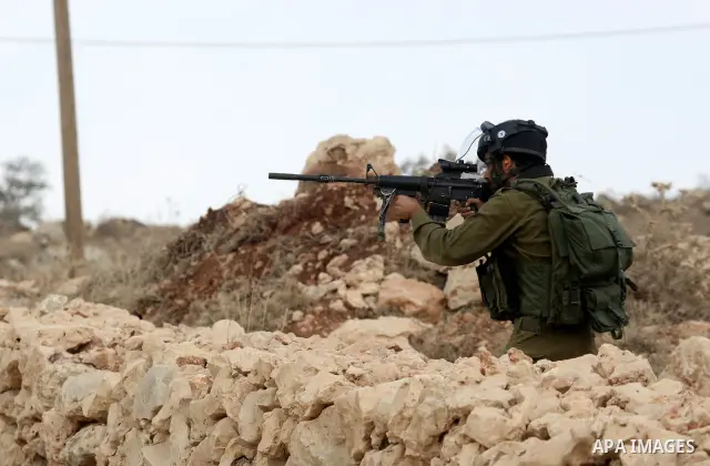 Israeli troops clash with Palestinian stone throwers in the West Bank village of Qusra, south of Nablus, on September 23, 2011. A Palestinian man was shot dead by Israeli troops in clashes which erupted after settlers at...