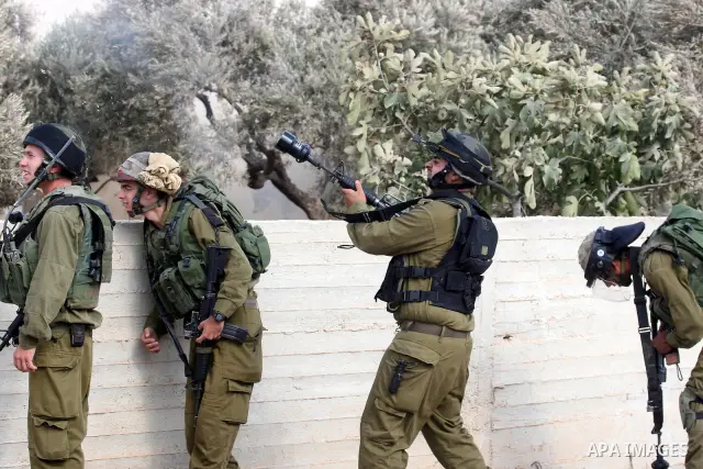 Israeli troops clash with Palestinian stone throwers in the West Bank village of Qusra, south of Nablus, on September 23, 2011. A Palestinian man was shot dead by Israeli troops in clashes which erupted after settlers at...