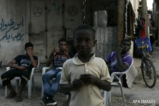 Palestinian children sit outside their houses in Rafah refugee camp, southern Gaza Strip on Sep. 24, 2011. Palestinian Authority President Mahmoud Abbas, hands over a formal letter to be admitted as a state to the UN Sec...