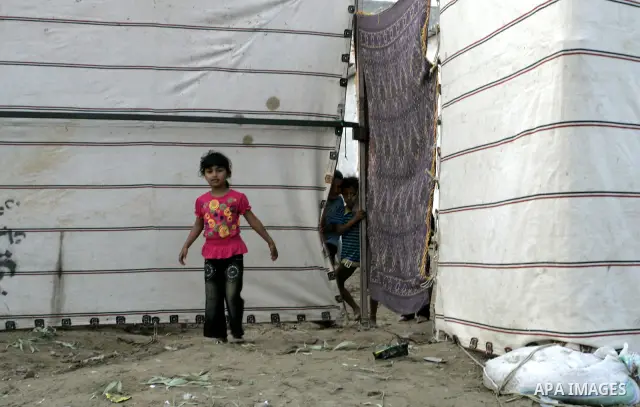 Palestinian children stand outside their houses in Rafah refugee camp, southern Gaza Strip on Sep. 24, 2011. Palestinian Authority President Mahmoud Abbas, hands over a formal letter to be admitted as a state to the UN S...