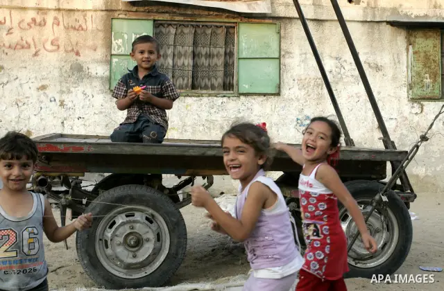 Palestinian children play outside their houses in Rafah refugee camp, southern Gaza Strip on Sep. 24, 2011. Palestinian Authority President Mahmoud Abbas, hands over a formal letter to be admitted as a state to the UN Se...