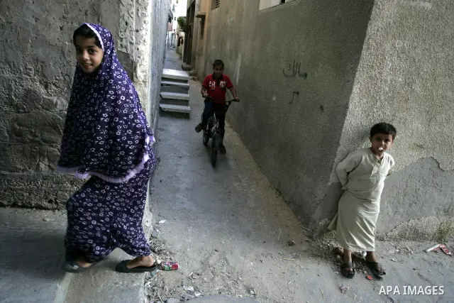 Palestinian children stand outside their houses in Rafah refugee camp, southern Gaza Strip on Sep. 24, 2011. Palestinian Authority President Mahmoud Abbas, hands over a formal letter to be admitted as a state to the UN S...