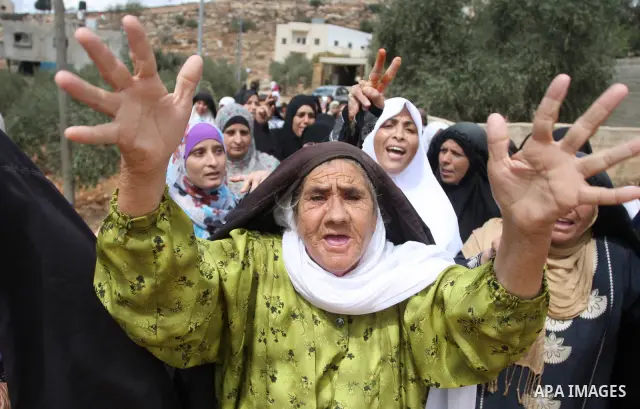 Palestinian women mourn during the funeral of Issam Badran in the West Bank village of Qusra near Nablus, Saturday, Sept. 24, 2011. Badran was shot dead Friday during a clash with Israeli soldiers and settlers. The shoot...