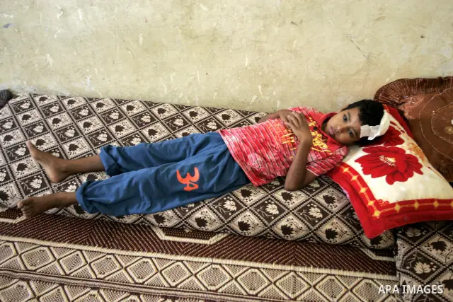 A Palestinian student, Bashir Ghaydah was injured in his head while playing in a school grounds of the Relief and Works Agency refugees "UNRWA" in Rafah, southern Gaza Strip on Sep. 25, 2011. UNRWA refuses to provide tre...