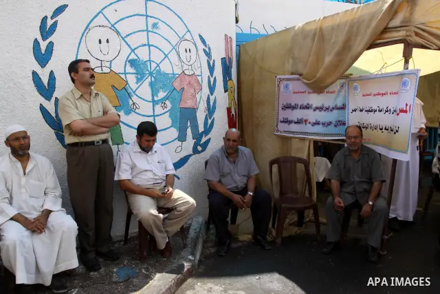 Members of the Palestinian Commissions for Refugees take part in a protest against the UNRWA to stop the work of one staff, in Gaza city on Sep. 25, 2011. Photo by Mohammed Asad