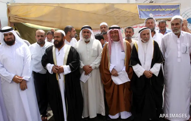 Members of the Palestinian Commissions for Refugees take part in a protest against the UNRWA to stop the work of one staff, in Gaza city on Sep. 25, 2011. Photo by Mohammed Asad