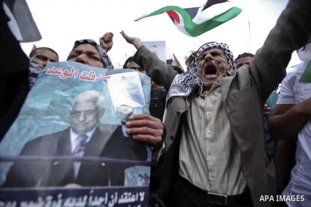 Thousands of cheering Palestinians welcome their president Mahmud Abbas outside his Ramallah headquarters on Sept. 25, 2011, as he returned from delivering a historic UN membership bid. Photo by Issam Rimawi