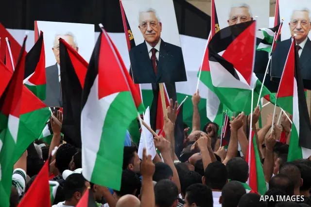 Thousands of cheering Palestinians welcome their president Mahmud Abbas outside his Ramallah headquarters on Sept. 25, 2011, as he returned from delivering a historic UN membership bid. Photo by Issam Rimawi