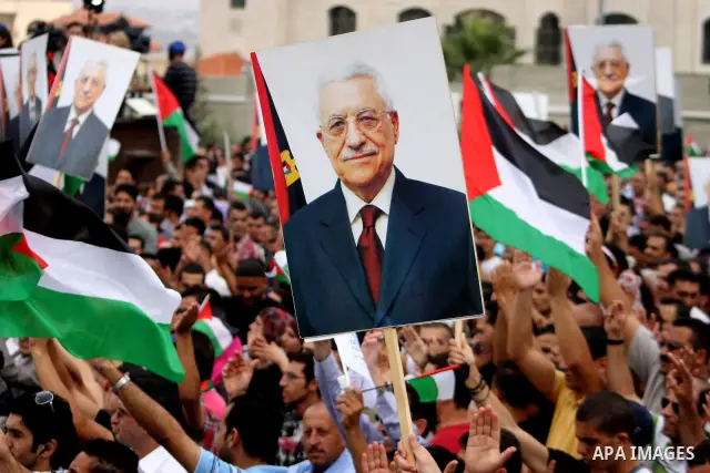 Thousands of cheering Palestinians welcome their president Mahmud Abbas outside his Ramallah headquarters on Sept. 25, 2011, as he returned from delivering a historic UN membership bid. Photo by Issam Rimawi