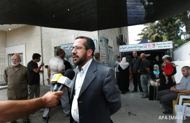 Member of Palestinians Hamas legislators, Khaled Abu Arafa delivers speech at the Red Cross compound in east Jerusalem on September 26, 2011, after the member of Hamas legislative council, Ahmad Atun was arrested in an o...