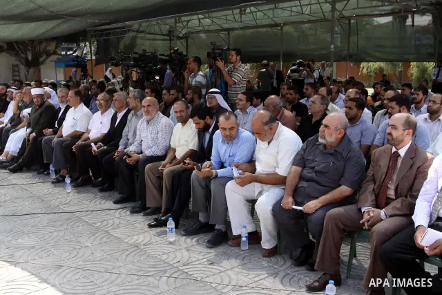 Palestinians take part in a protest against arrested the member of Hamas legislative council, Ahmad Atun in an operation by undercover police officers in Gaza city on Sep. 27, 2011. Atun is one of three senior Hamas MPs...
