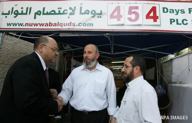 Members of Palestinians Hamas legislators, take part in a protest at the Red Cross compound in east Jerusalem on September 27, 2011, after the member of Hamas legislative council, Ahmad Atun was arrested in an operation...