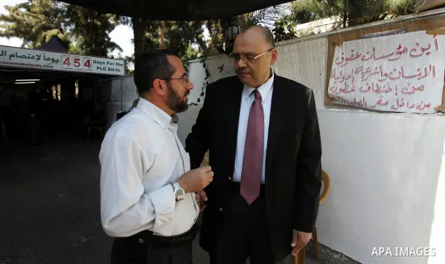 Members of Palestinians Hamas legislators, take part in a protest at the Red Cross compound in east Jerusalem on September 27, 2011, after the member of Hamas legislative council, Ahmad Atun was arrested in an operation...