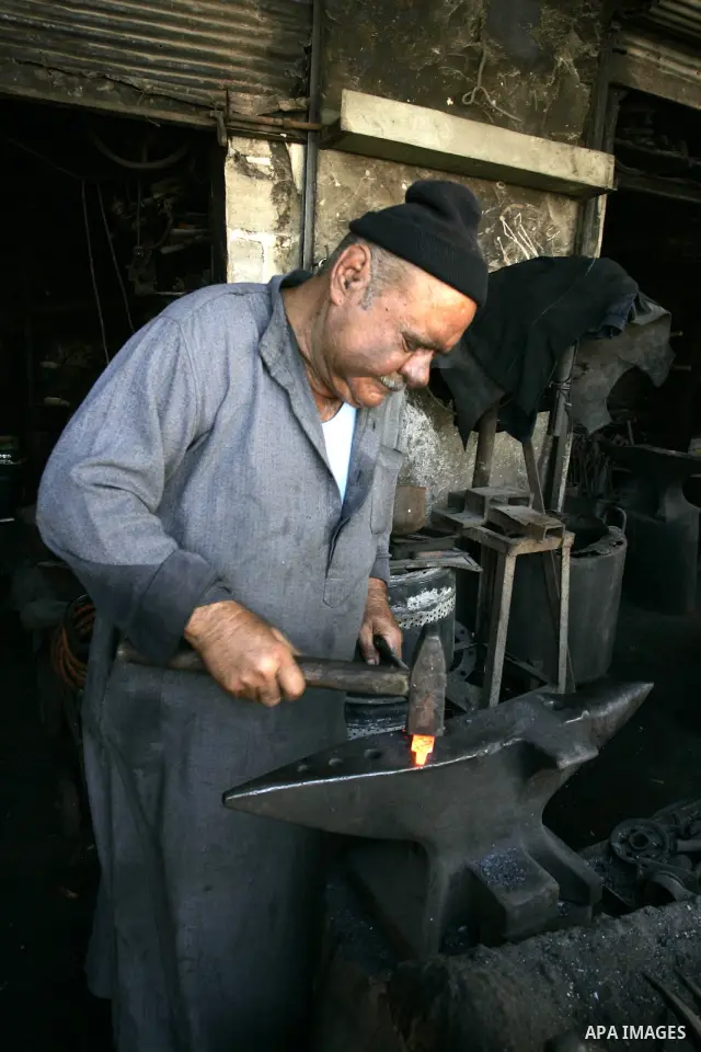 A Palestinian man works at a metal workshop in Rafah, southern Gaza Strip on Sept 28, 2011. An Israeli cabinet minister urged the government to accept a Quartet proposal for an immediate renewal of talks with the Palesti...