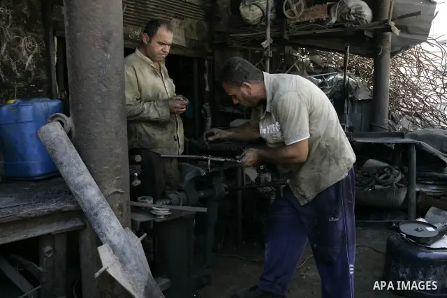 A Palestinian man works at a metal workshop in Rafah, southern Gaza Strip on Sept 28, 2011. An Israeli cabinet minister urged the government to accept a Quartet proposal for an immediate renewal of talks with the Palesti...