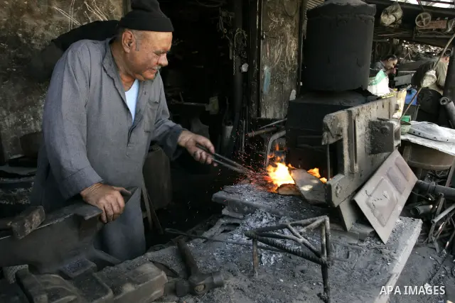 A Palestinian man works at a metal workshop in Rafah, southern Gaza Strip on Sept 28, 2011. An Israeli cabinet minister urged the government to accept a Quartet proposal for an immediate renewal of talks with the Palesti...