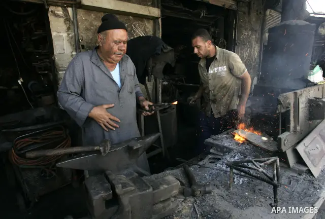 A Palestinian man works at a metal workshop in Rafah, southern Gaza Strip on Sept 28, 2011. An Israeli cabinet minister urged the government to accept a Quartet proposal for an immediate renewal of talks with the Palesti...