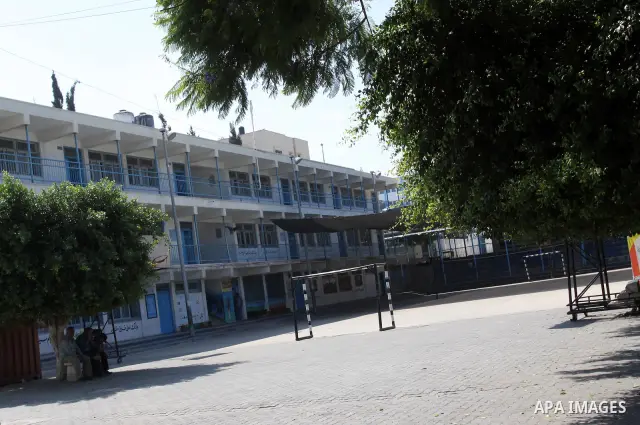 Palestinians sit in the United Nations Relief and Works Agency (UNRWA) closed school, in Gaza City on Sept. 29, 2011, against the decision made to suspend Staff Union President, Suhail al-Hindi. Some 16 thousand Palestin...