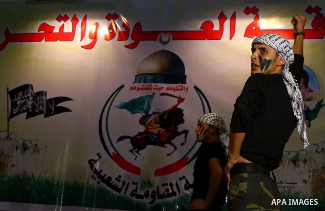 Palestinian supporters of Popular Resistance Committees take part in a rally to mark the 12th anniversary of Al-Aqsa Intifada (uprising) in Gaza city on Sept. 29,2011. Israel on Tuesday approved construction of 1,100 hom...