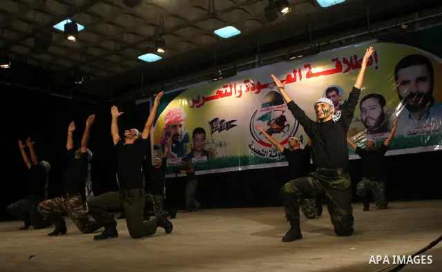 Palestinian supporters of Popular Resistance Committees take part in a rally to mark the 12th anniversary of Al-Aqsa Intifada (uprising) in Gaza city on Sept. 29,2011. Israel on Tuesday approved construction of 1,100 hom...